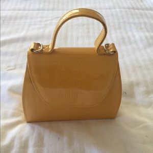 Small mustard patent purse with optional strap